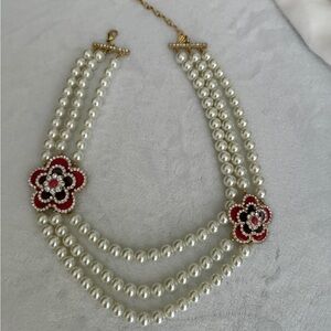 Elegant Triple-Strand Pearl Necklace with Red Flower Accents